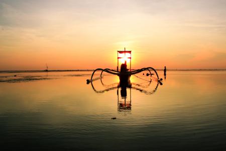 Sailboat on Clear Calm Sea Floating during Sunset