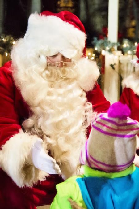 Santa Claus Greeting Children