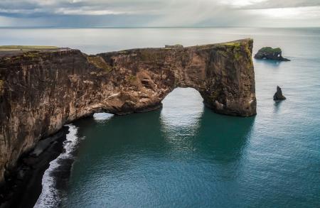 Scenic View of Cliff by Sea