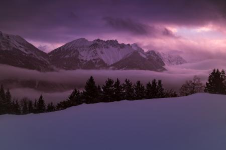 Scenic View of Lake Against Dramatic Sky at Sunset