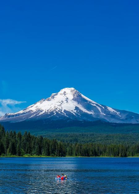 Scenic View of Lake Against Mountain Range