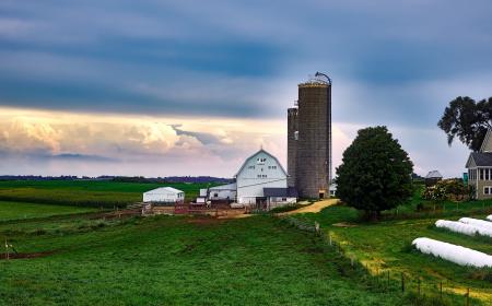 Scenic View of Landscape Against Cloudy Sky