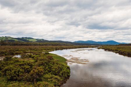 Scenic View of Landscape During Cloudy Sky