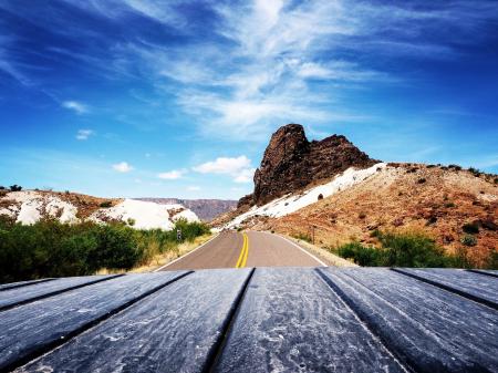 Scenic View of Mountain Road Against Blue Sky