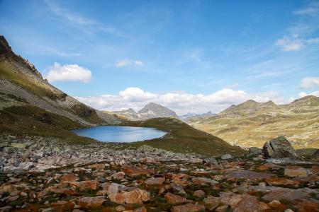 Scenic View of Mountains Against Blue Sky