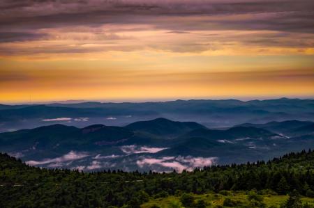 Scenic View of Mountains Against Cloudy Sky