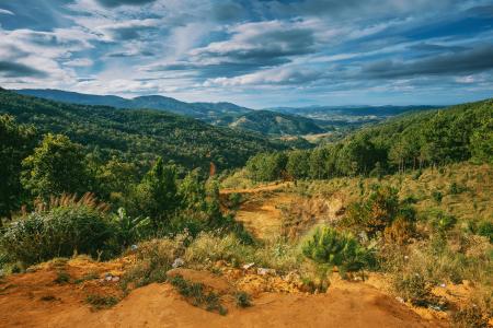 Scenic View of Mountains Under Cloudy Sky