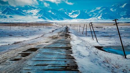 Scenic View of Snow Covered Mountains Against Sky