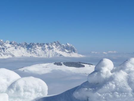 Scenic View of Snow Mountains Against Blue Sky
