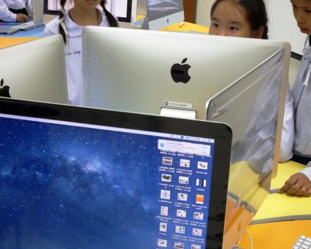 School students using Apple Macs