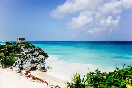 Sea Near Island Under Blue Sky