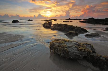 Sea Rock Under White Clouds Blue Skies during Sunset