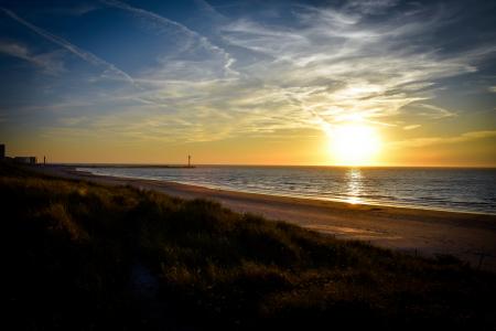 Sea Shore Beside Body of Water during Sunset