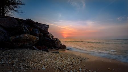 Black Rock Beside the Sea Under the Sunset