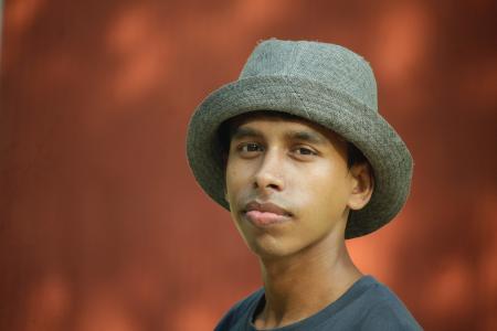 Selective Focus Photography of Man Wearing Gray Fedora Hat and Gray Crew-neck Shirt