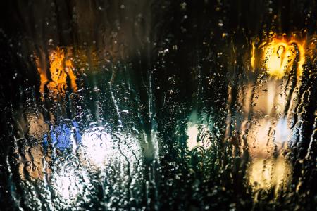 Selective Photography of Glass Window With Drops of Water during Nighttime