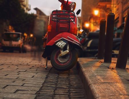 Selective Photography of Red Motor Scooter