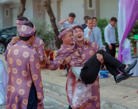 Several Men Wearing Purple-and-gold Traditional Dresses