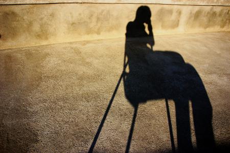 Shadow of a sitting person