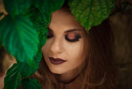 Shallow Focus Photography of Woman Near Leafy Tree