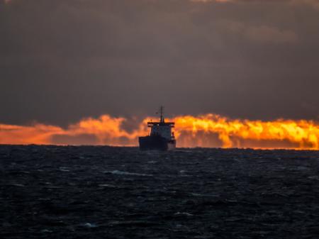 Ship on sunset fire