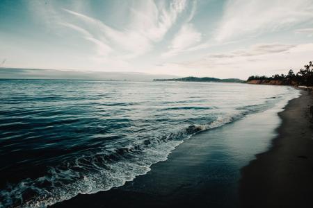 Shoreline Under Blue Sky