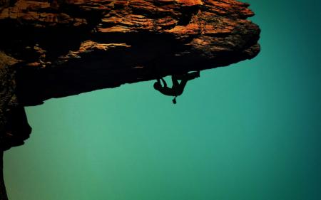 Silhouette of a rock-climber