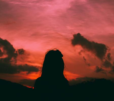 Silhouette of a Woman During Dawn