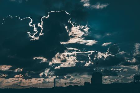 Silhouette of Building Under Cloudy Blue Sky