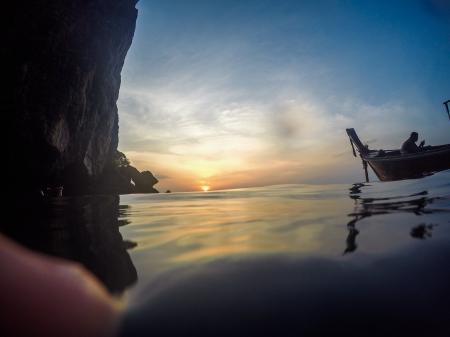 Silhouette of Man Riding Boat