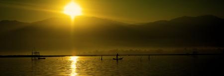 Silhouette of People Riding Boats on Water during Daytime