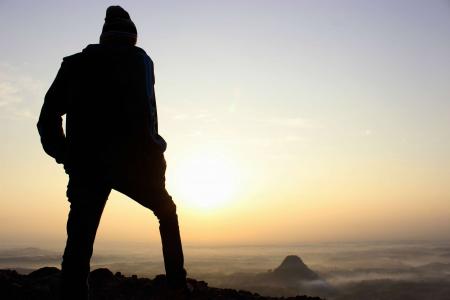 Silhouette of Person Walking on Vast Land