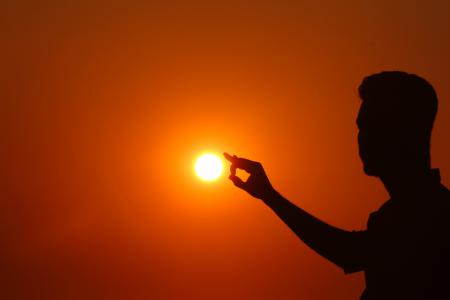 Silhouette of Woman Against Sunset