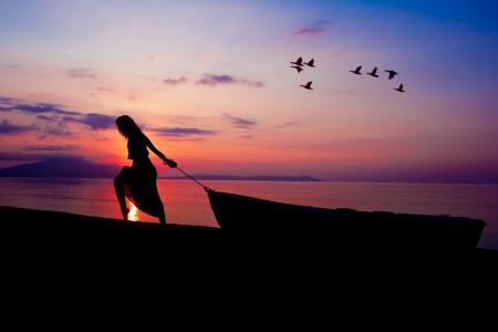 Silhouette on Person Towing Canoe