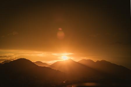 Silhouette Photo of Mountain Range during Golden Hour