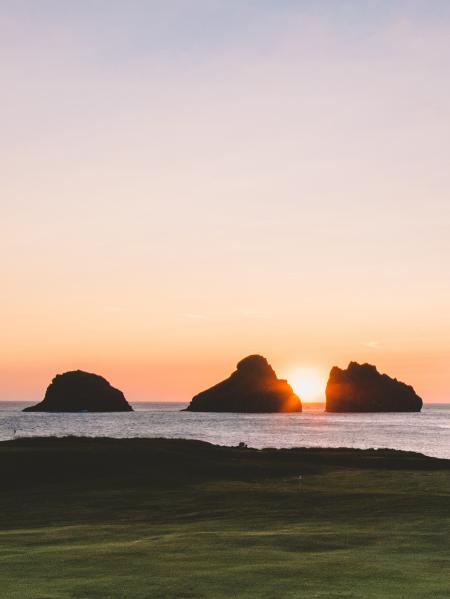 Silhouette Photo of Mountains on Body of Water