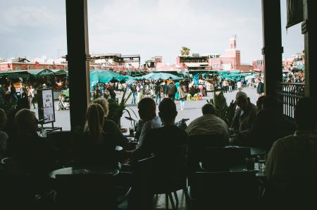 Silhouette Photo of People Sitting on Chairs
