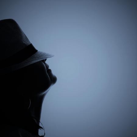 Silhouette Photo of Person Wearing Hat