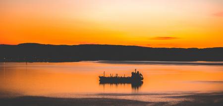Silhouette Photography of Mountain and Body of Water