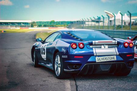 Silverstone Blue Silver Stripe Race Car on Track