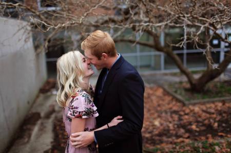 Smiling Couple Standing Near Bare Tree Outdoors Macro Shot