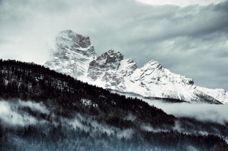 Snow Covered Mountain Under Cloudy Sky