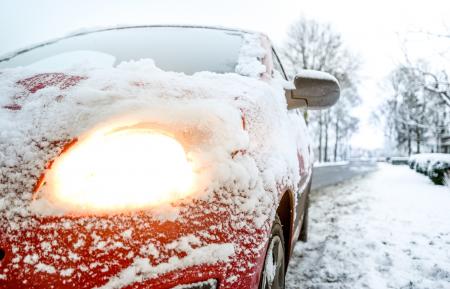 Snow Covered Red Sedan