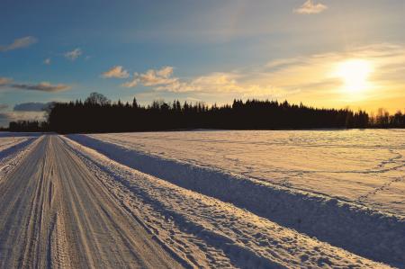 Snow Covered Road during Golden Hour