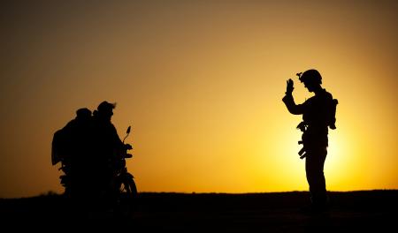 Soldier Waving to Civilians