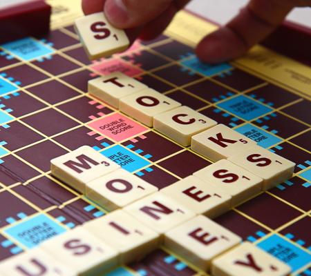 Spelling Out Business Stocks And Money Using Tiles