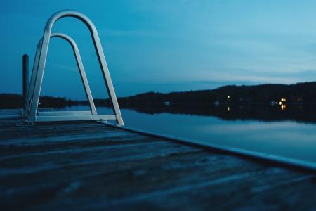 Stainless Steel Side Ladder Near Body of Water