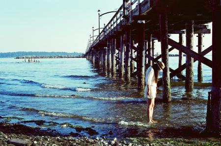 Standing in the Water under the Pier