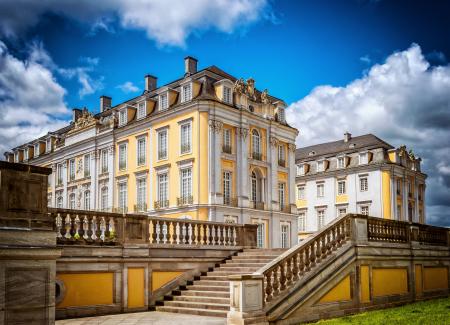 Statue of House in City Against Sky