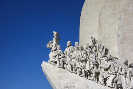 Statue on Roof Under White and Blue Sky